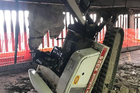 cleveland skid steer falls through parking garage|Worker injured when excavator crashes through 2 floors in .